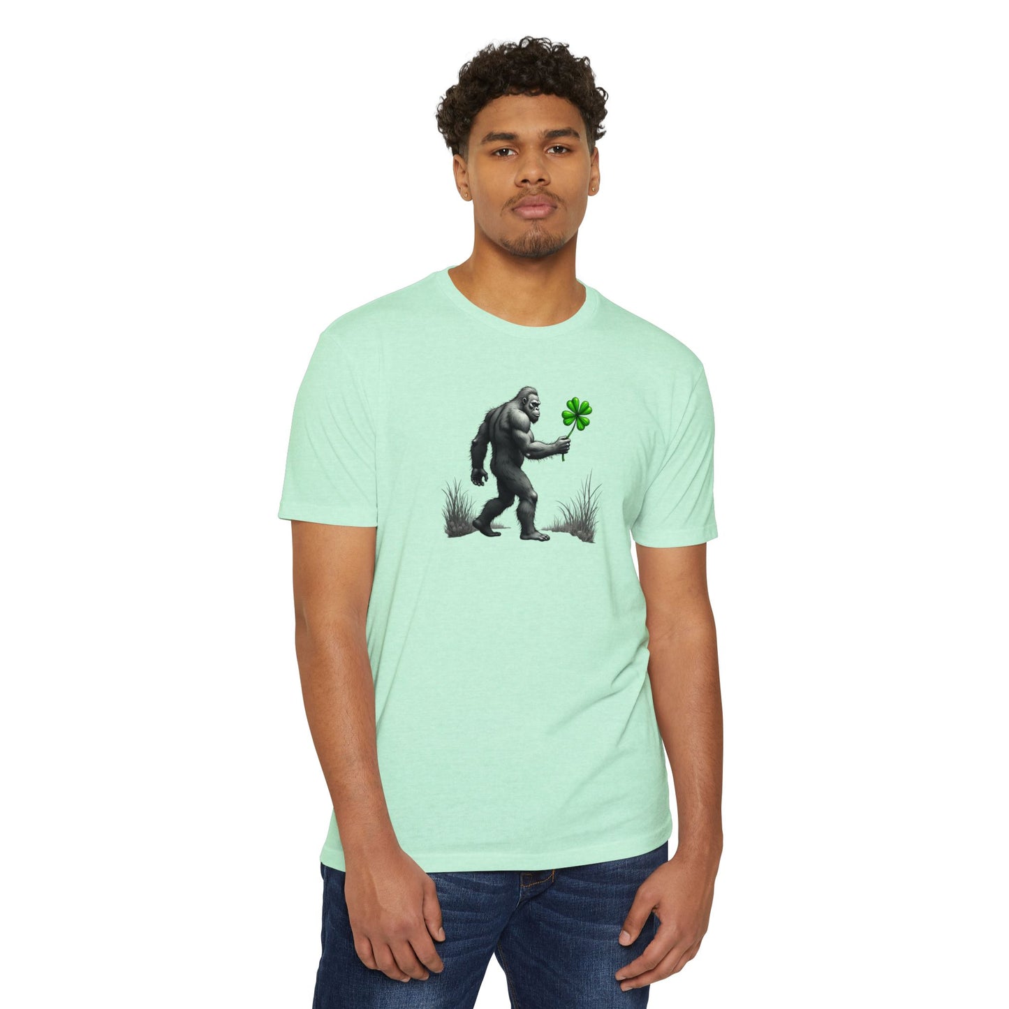 Bigfoot Holding Clover T‑Shirt — Funny Sasquatch St. Patrick’s Day Tee