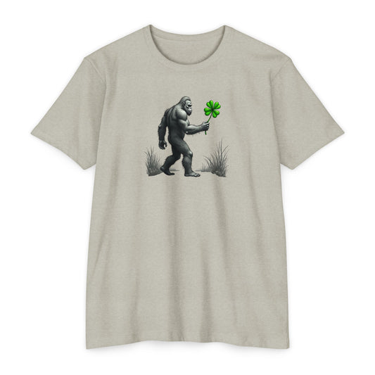 Bigfoot Holding Clover T‑Shirt — Funny Sasquatch St. Patrick’s Day Tee
