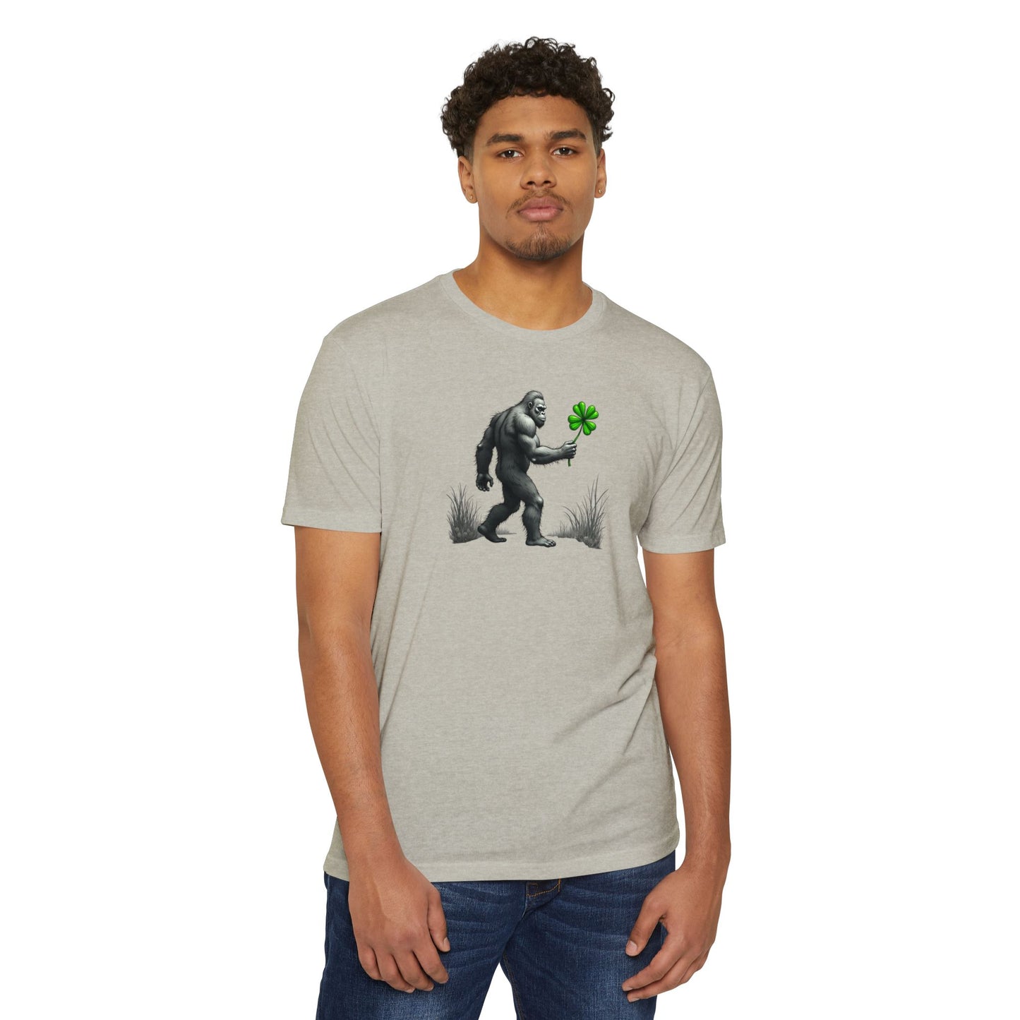 Bigfoot Holding Clover T‑Shirt — Funny Sasquatch St. Patrick’s Day Tee