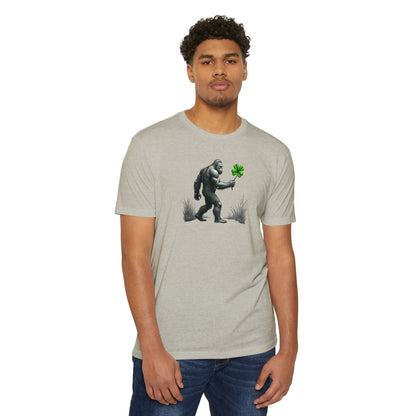 Bigfoot Holding Clover T‑Shirt — Funny Sasquatch St. Patrick’s Day Tee