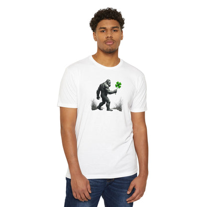 Bigfoot Holding Clover T‑Shirt — Funny Sasquatch St. Patrick’s Day Tee